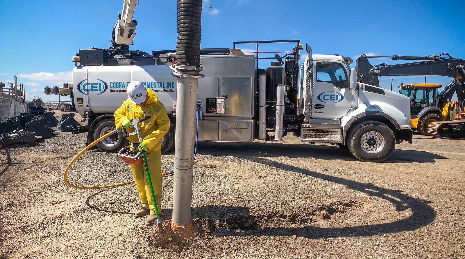 CEI hydro excavation crew exposing an underground utility with a vacuum truck in South Florida